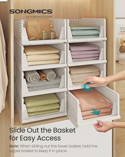 Stackable storage baskets with folded clothes, easy access design.